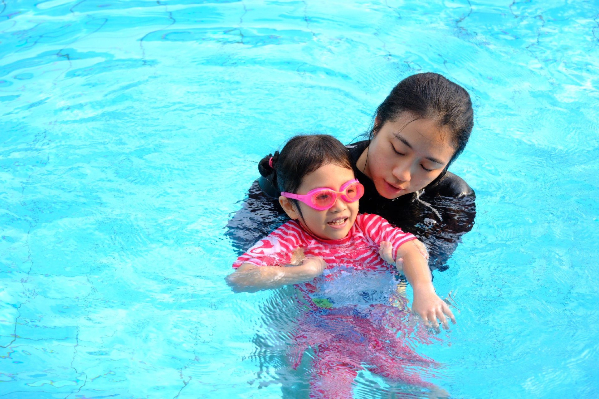 One to one stroke correction coaching at a Singapore condominium swimming pool