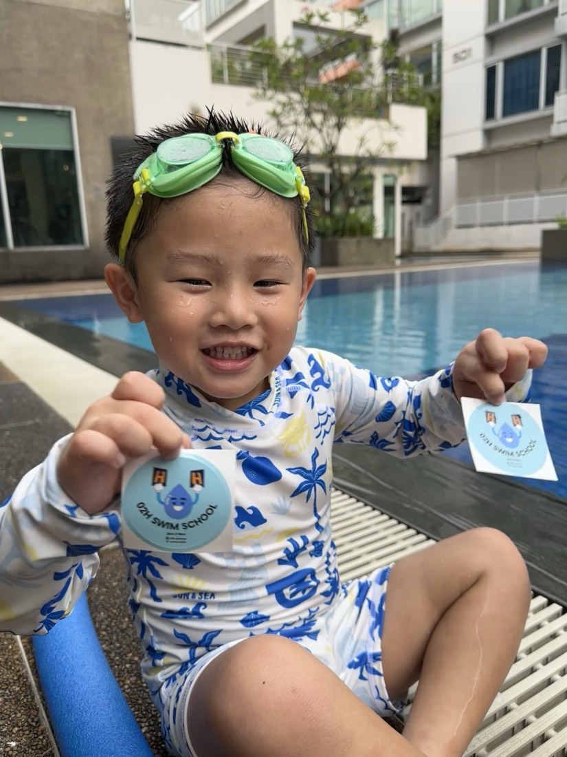 02H student celebrating a swimming milestone